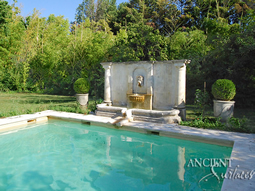 Antique stone wall fountain salvaged from the island of Corsica